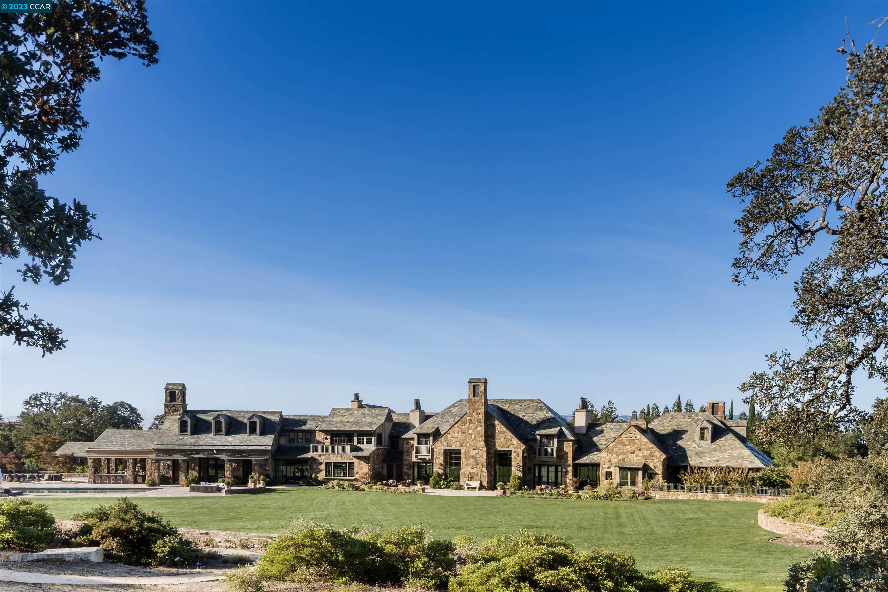7 Country Oak Lane Alamo, CA 94507 - Photo 2 of 56 a view of a house with a big yard and large trees