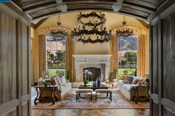 a living room with fireplace furniture and a fireplace