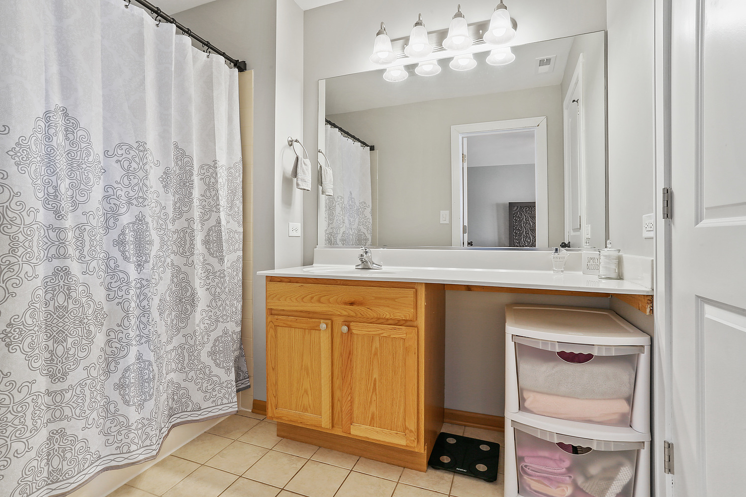 7007 Creekside Drive Plainfield, IL 60586 - Photo 17 of 21 a bathroom with a double vanity sink and a mirror