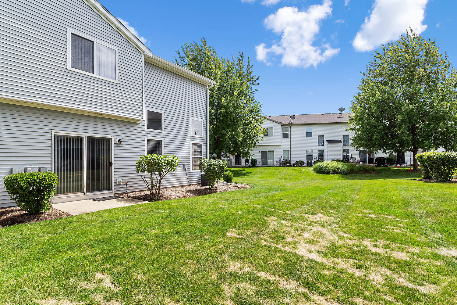 7007 Creekside Drive Plainfield, IL 60586 - Photo 20 of 21 a house view with a sitting space and garden