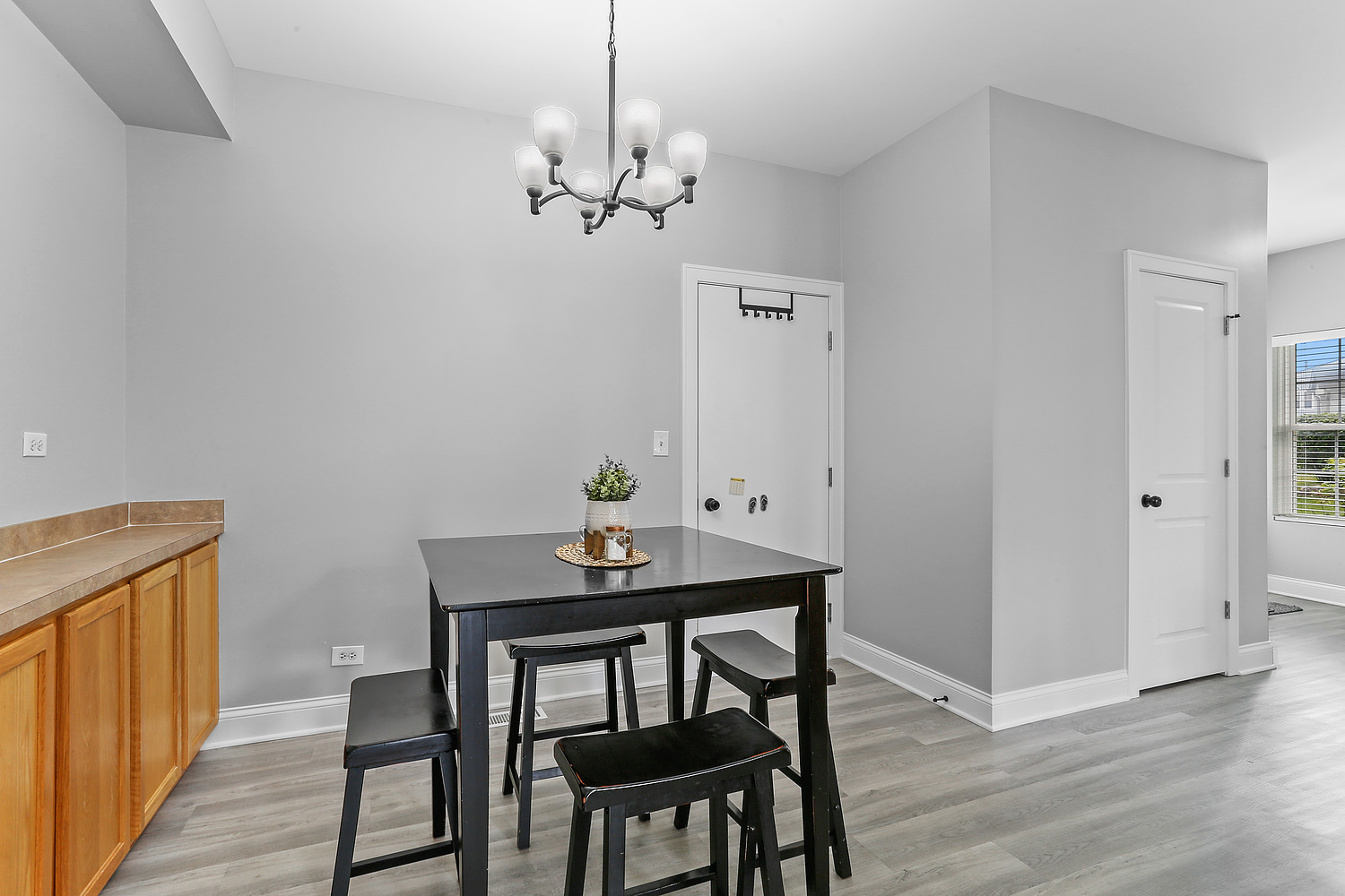 7007 Creekside Drive Plainfield, IL 60586 - Photo 5 of 21 a view of a dining room with furniture and wooden floor