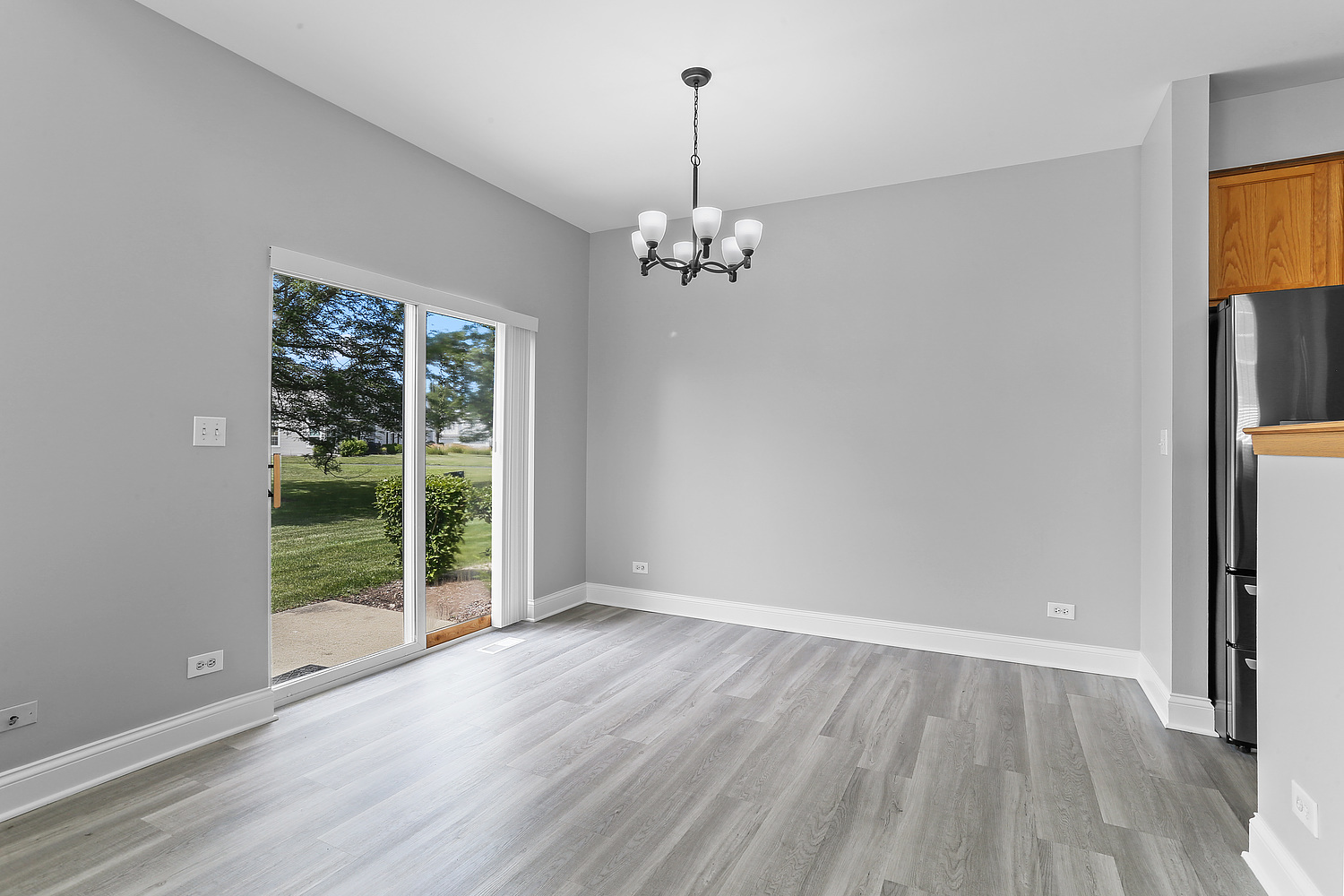 7007 Creekside Drive Plainfield, IL 60586 - Photo 10 of 21 wooden floor in an empty room with a window
