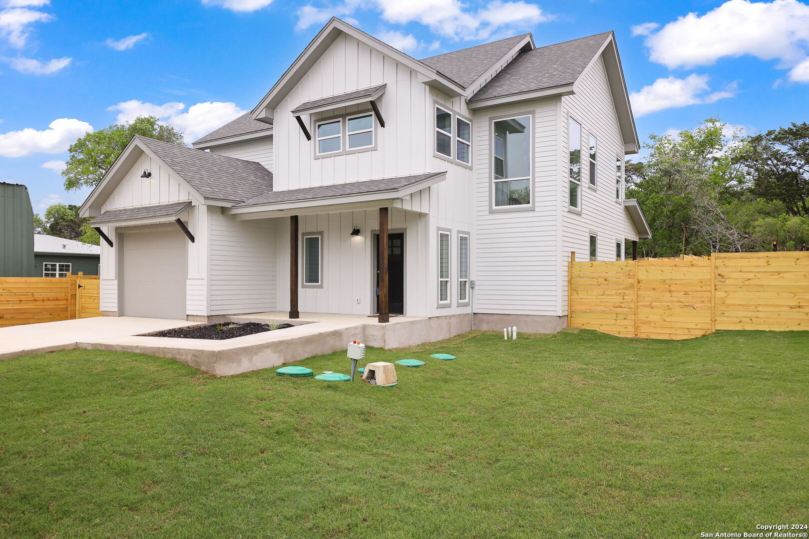 2367 Hornsby Spring Branch, TX 78070 - Photo 1 of 1 a front view of a house with a yard and garage