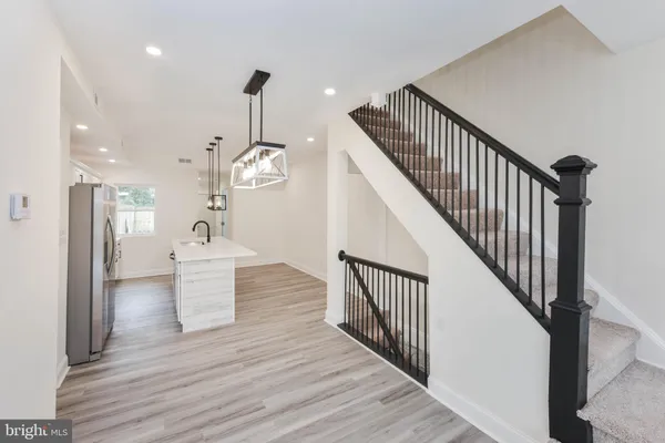 a bathroom with a toilet a sink and a mirror