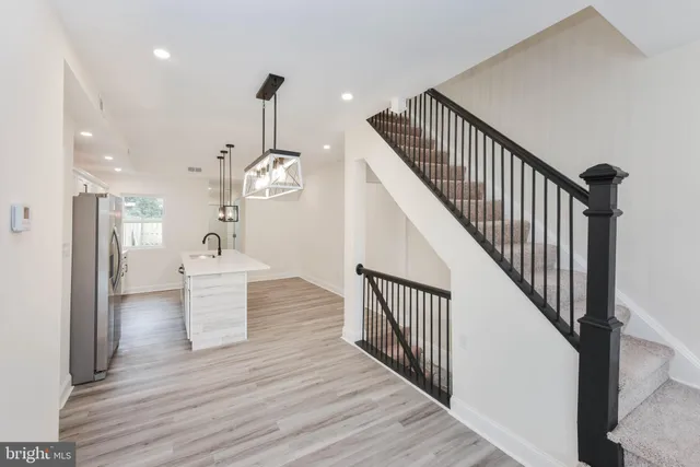 a bathroom with a toilet a sink and a mirror