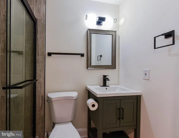 a bathroom with a shower and toilet