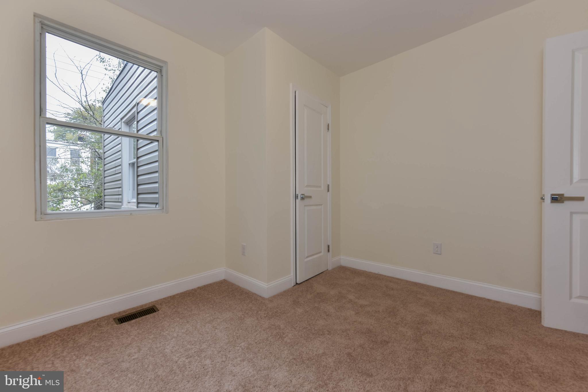 3108 Brighton Street Baltimore, MD 21216 - Photo 24 of 31 an empty room with windows