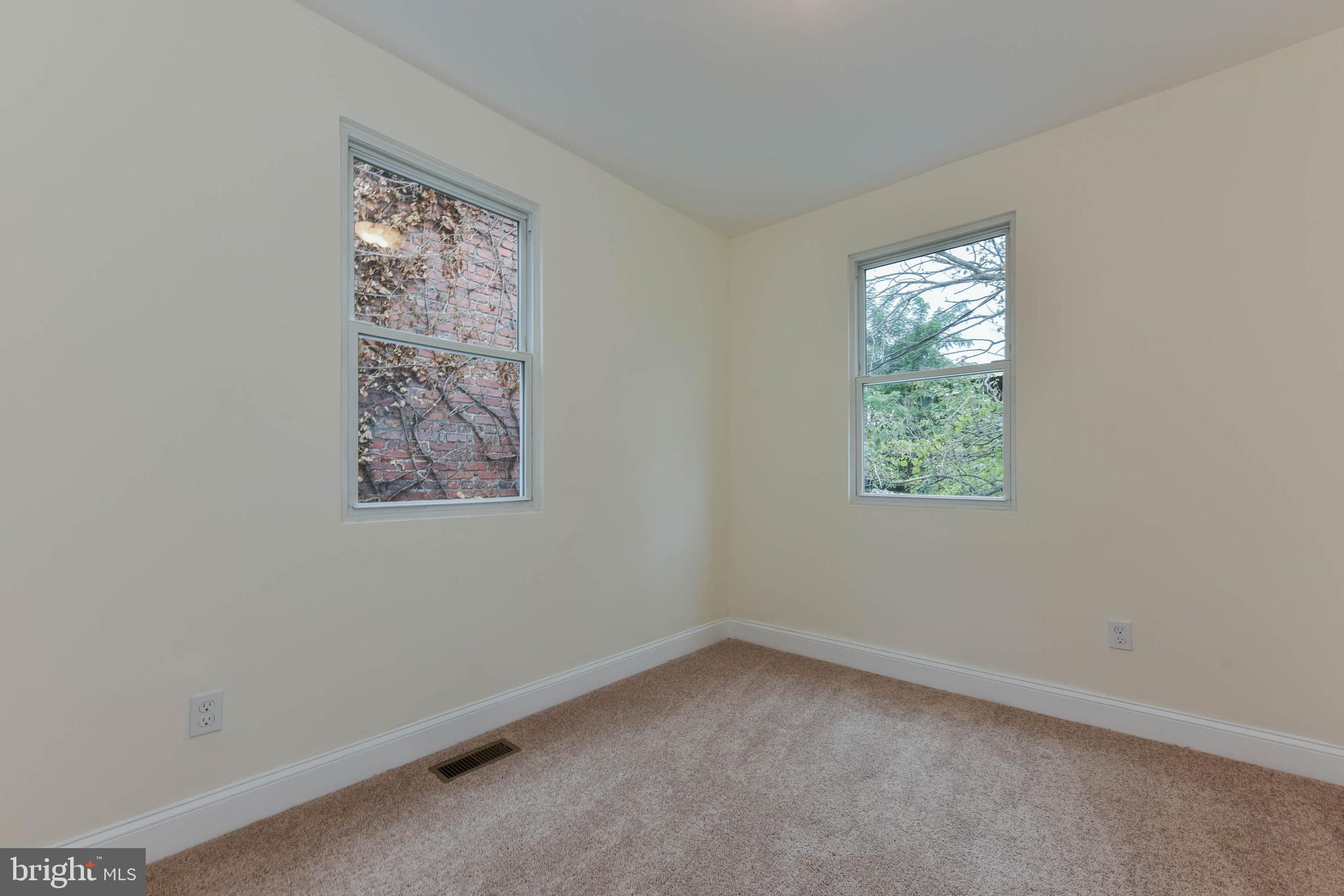 3108 Brighton Street Baltimore, MD 21216 - Photo 27 of 31 an empty room with a window