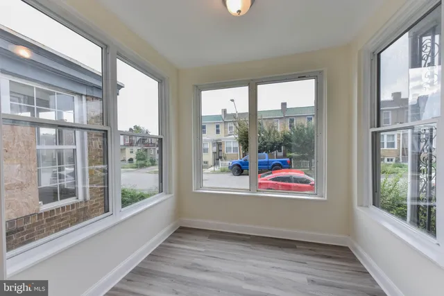a room with window and wooden floor