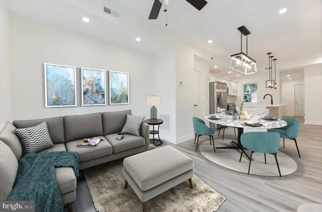 a view of a room with wooden floor and windows