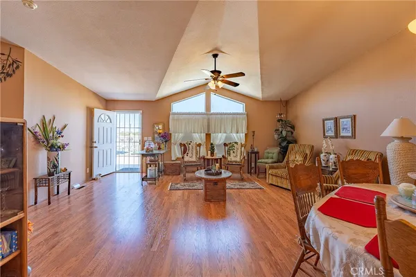 a view of a dining room with furniture and wooden floor