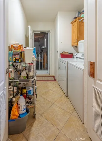 a bedroom with a bed and flat screen tv