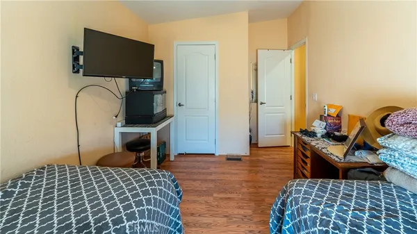 a bedroom with furniture and a chandelier