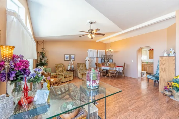 a view of a dining room with furniture and wooden floor