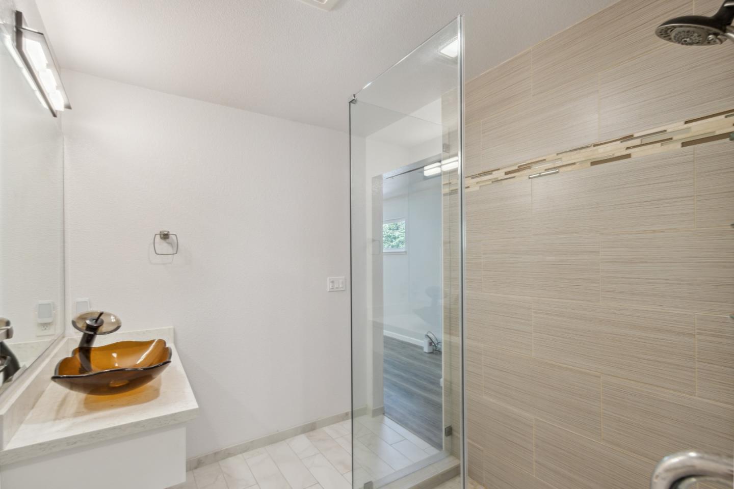 24895 Skyland Road Los Gatos, CA 95033 - Photo 22 of 113 a bathroom with a sink and shower