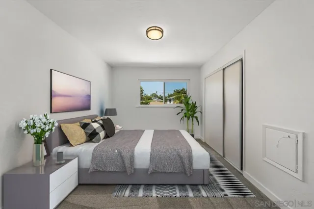 a bedroom with a bed and a couch