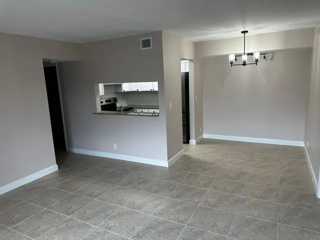 a view of a kitchen with a sink