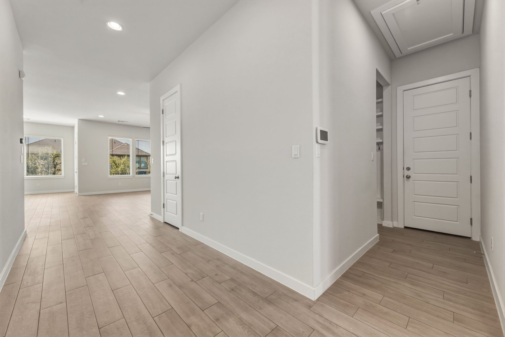 116 Tanali Trail Georgetown, TX 78628 - Photo 13 of 40 Hallway with light wood-style flooring and recessed lighting