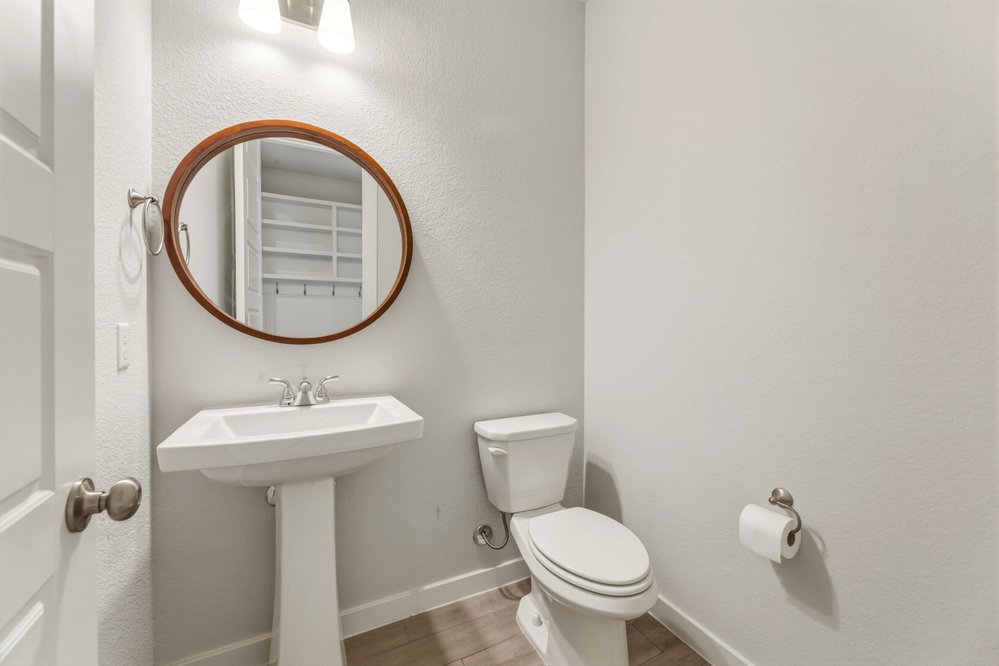 116 Tanali Trail Georgetown, TX 78628 - Photo 16 of 40 Half bath with a textured wall and light wood-style flooring