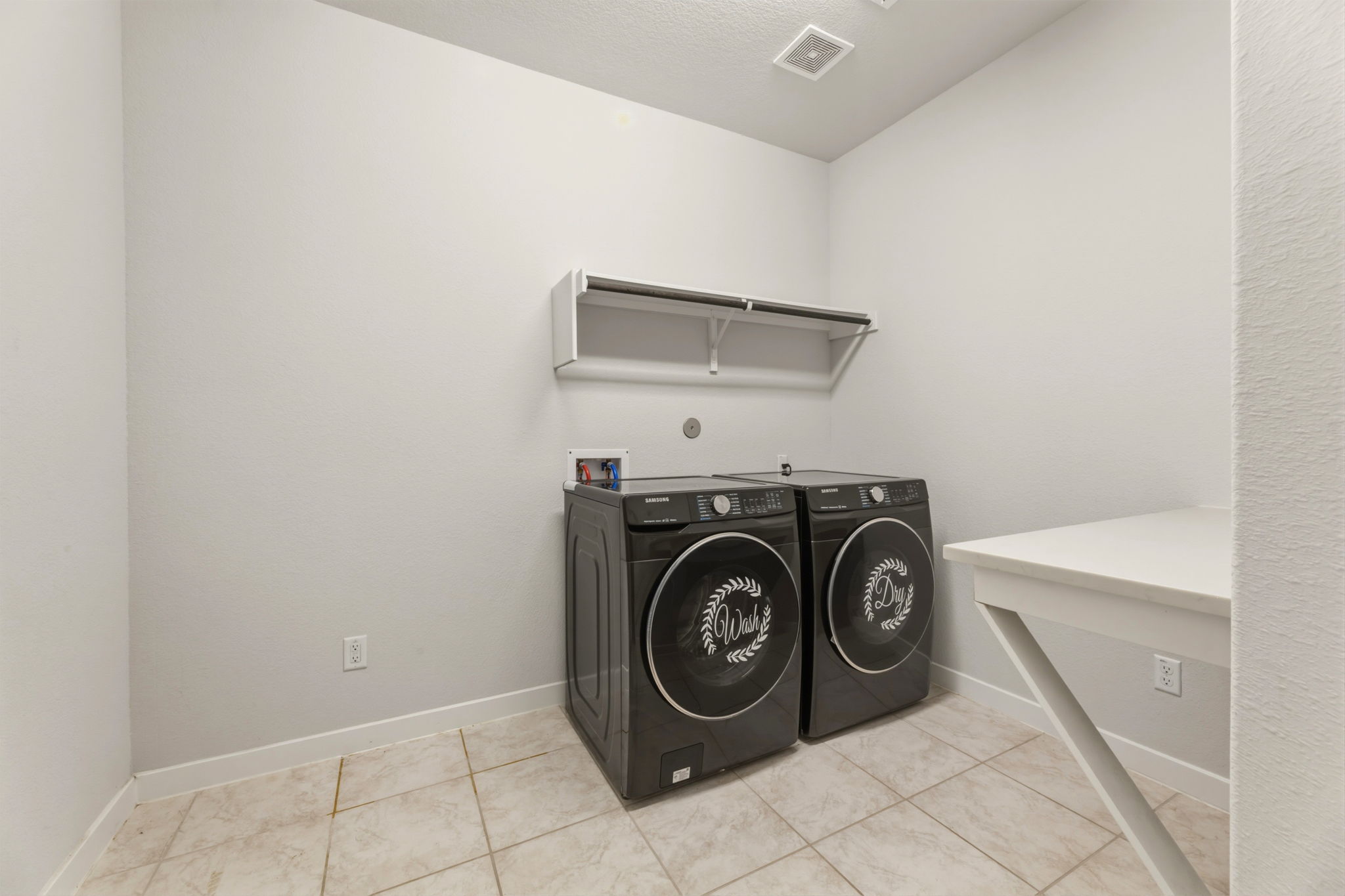 116 Tanali Trail Georgetown, TX 78628 - Photo 17 of 40 Laundry area featuring baseboards and independent washer and dryer