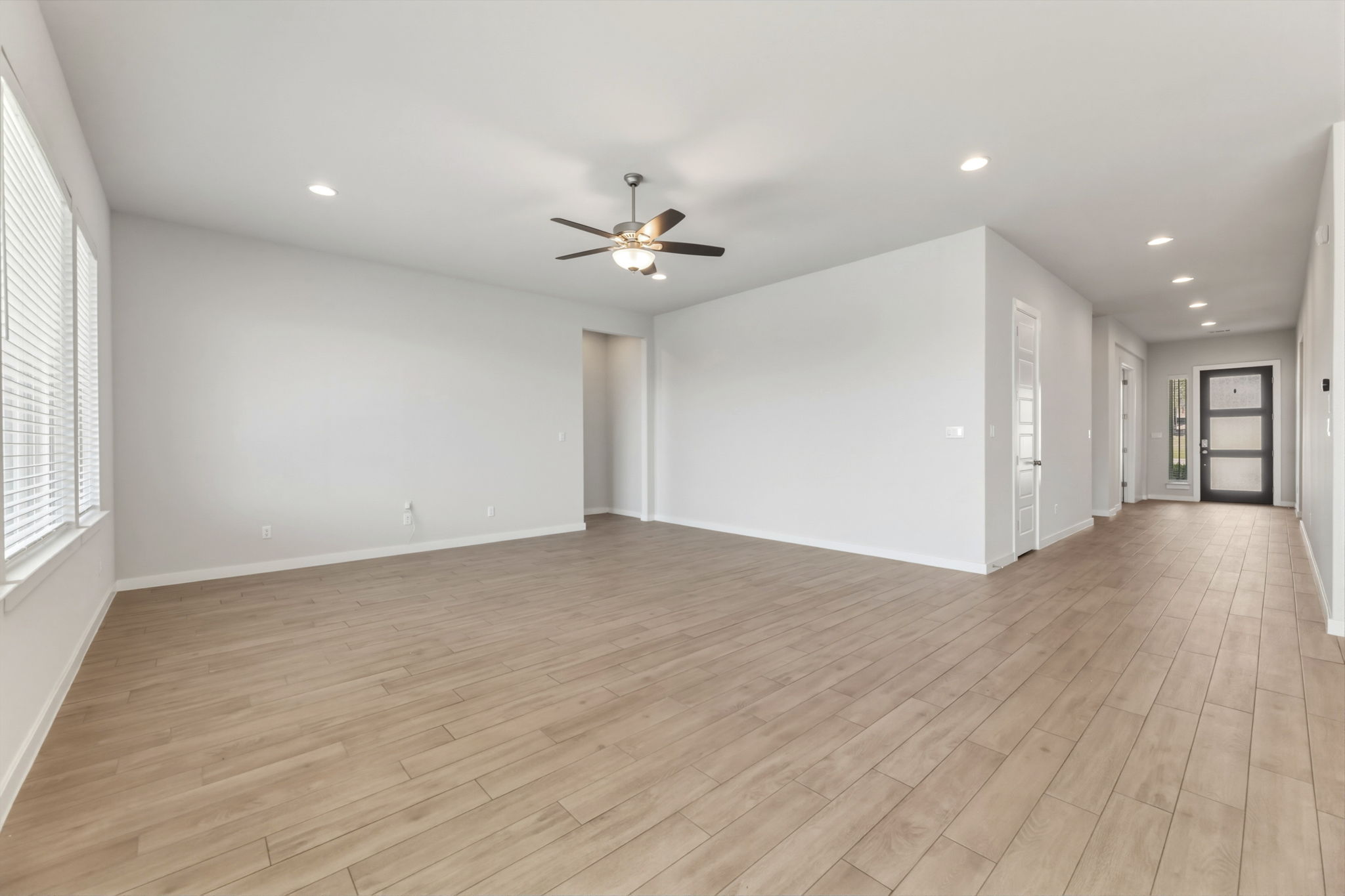 116 Tanali Trail Georgetown, TX 78628 - Photo 23 of 40 Spare room with light wood-style flooring, a ceiling fan, and recessed lighting