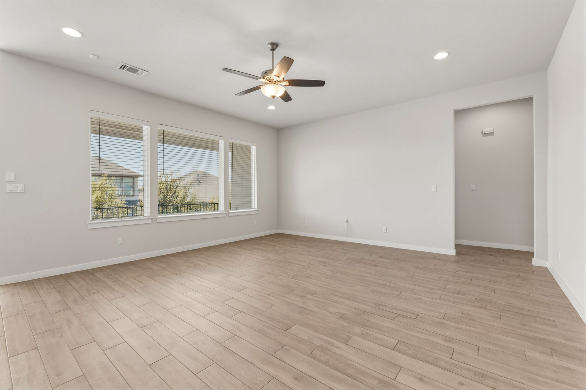 116 Tanali Trail Georgetown, TX 78628 - Photo 24 of 40 Unfurnished room featuring a ceiling fan, light wood-type flooring, and recessed lighting