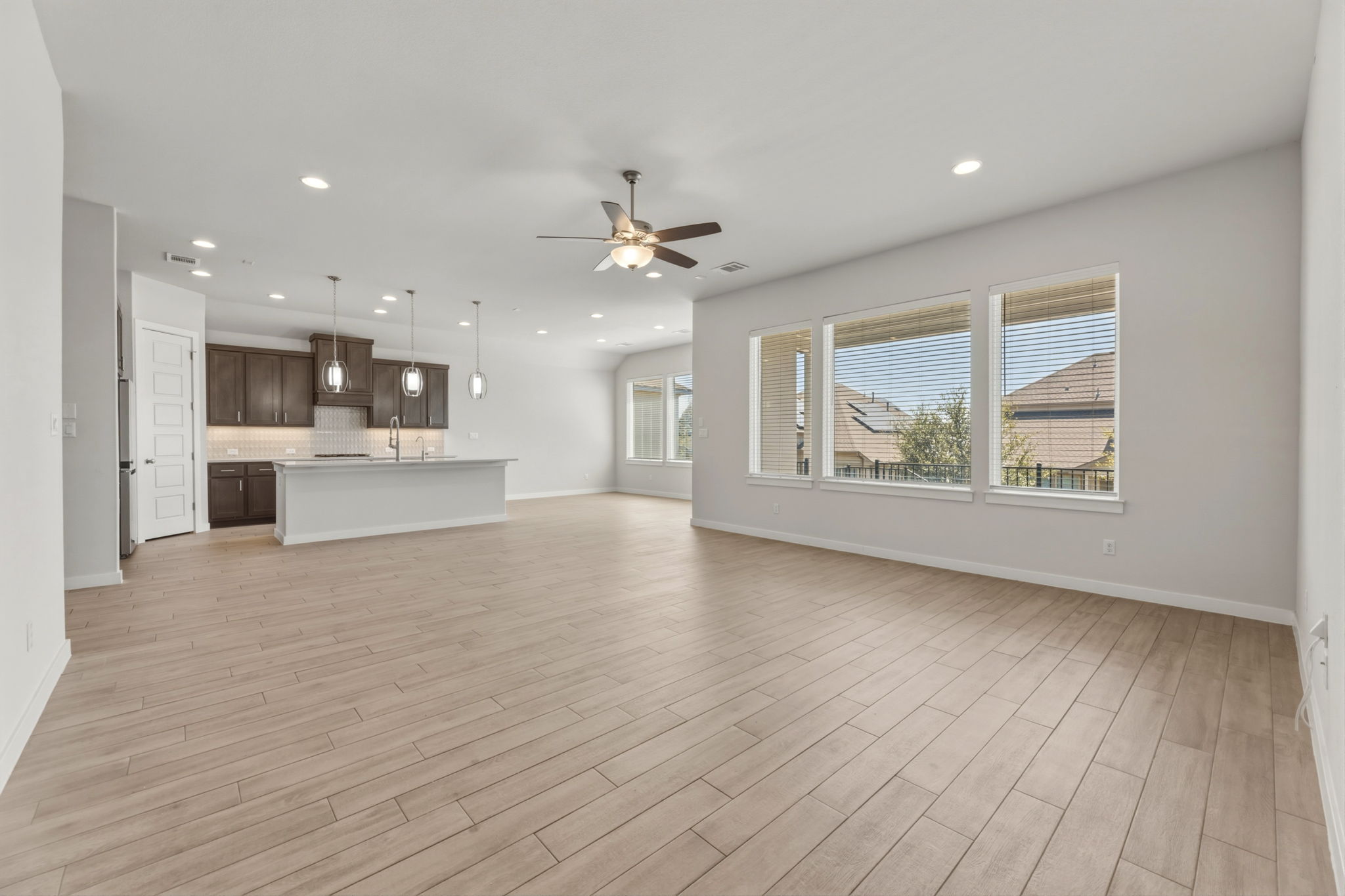 116 Tanali Trail Georgetown, TX 78628 - Photo 25 of 40 Unfurnished living room with wood finish floors, recessed lighting, and ceiling fan