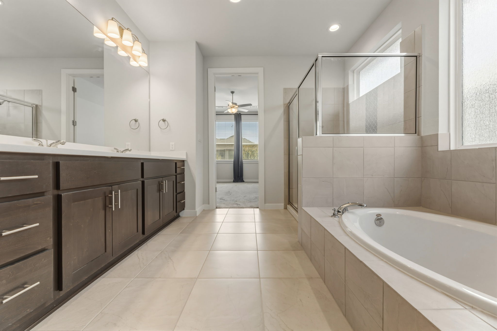 116 Tanali Trail Georgetown, TX 78628 - Photo 33 of 40 Bathroom featuring vanity, a shower stall, a bath, ceiling fan, and recessed lighting