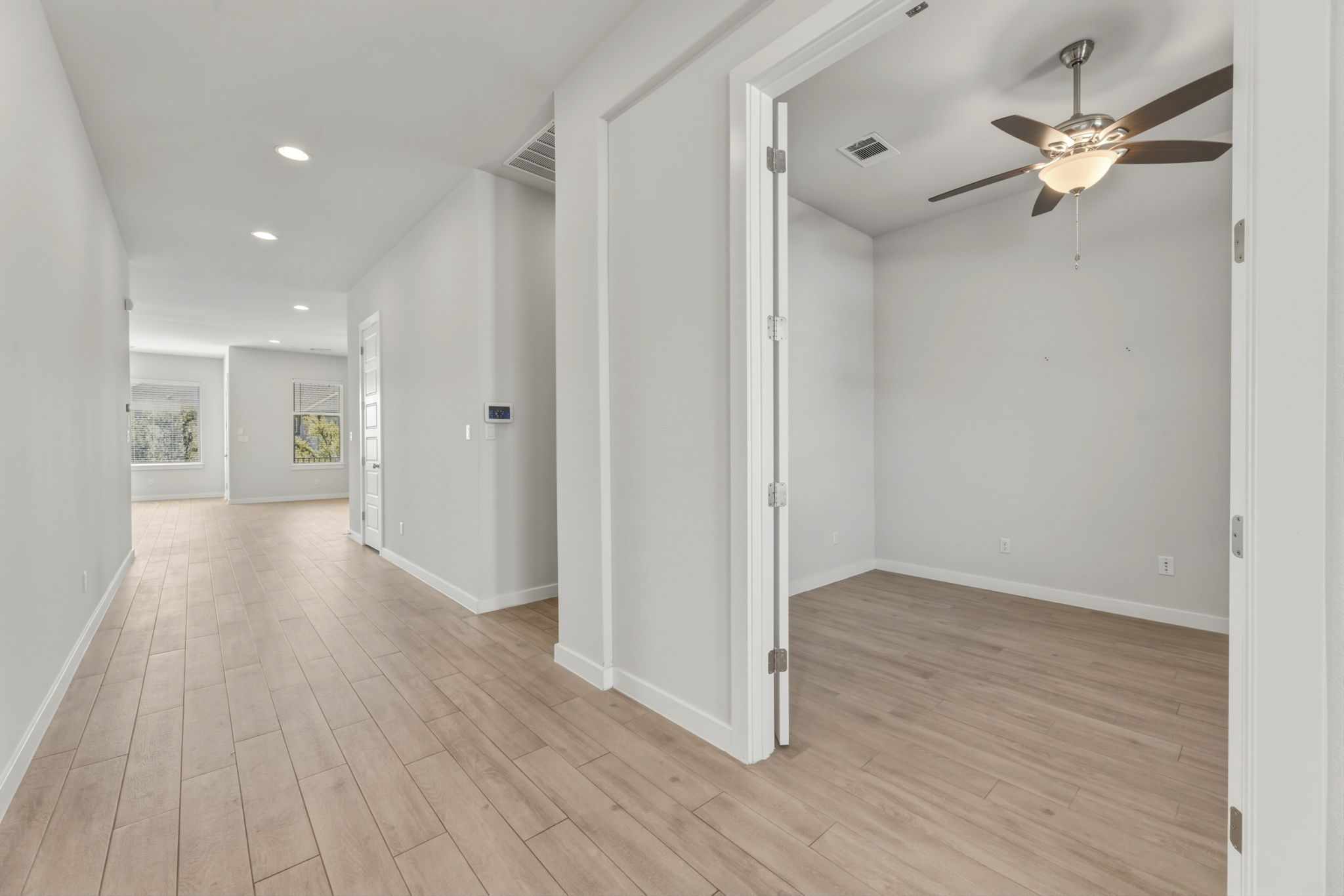 116 Tanali Trail Georgetown, TX 78628 - Photo 6 of 40 Corridor with recessed lighting and light wood-style floors