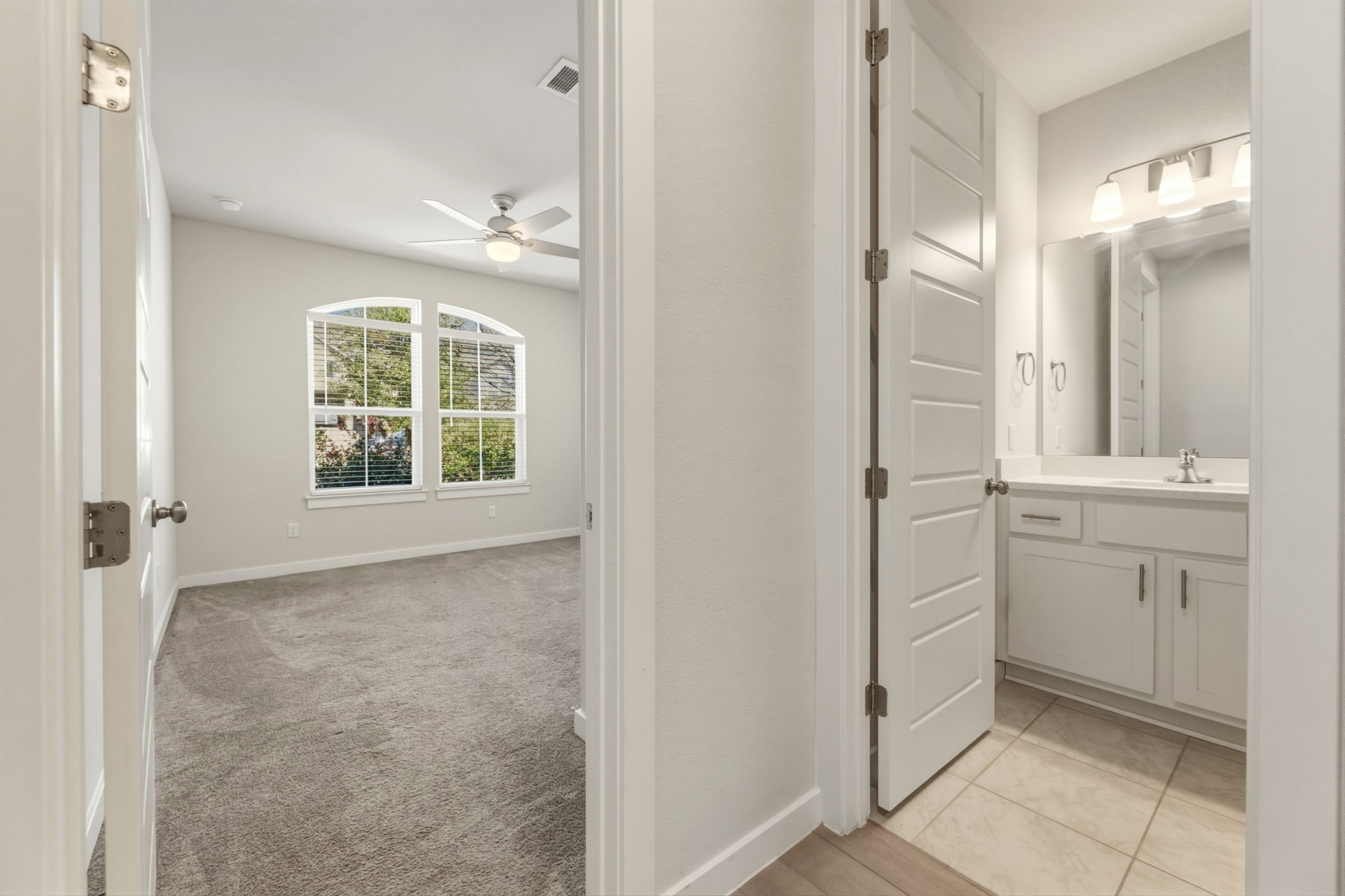 116 Tanali Trail Georgetown, TX 78628 - Photo 8 of 40 Bathroom featuring vanity, light carpet, and ceiling fan