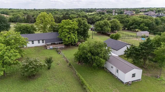 an aerial view of a house with a garden