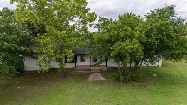 a view of a swimming pool with a patio