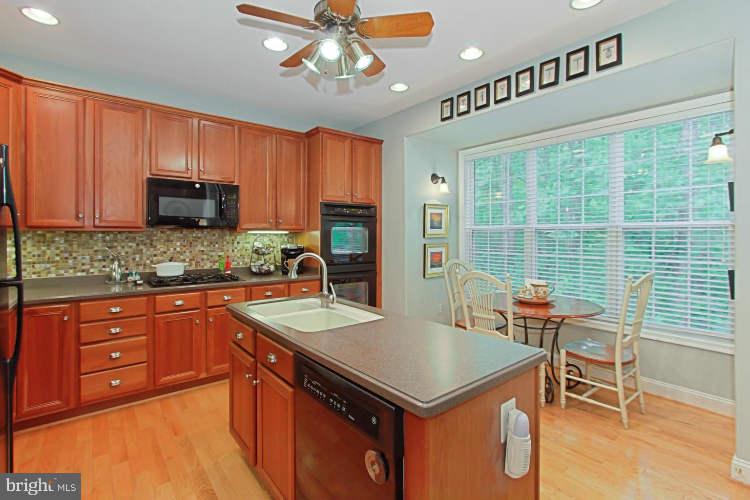8548 Bauer Circle Springfield, VA 22152 - Photo 11 of 30 a kitchen with a cabinets appliances and a counter top space