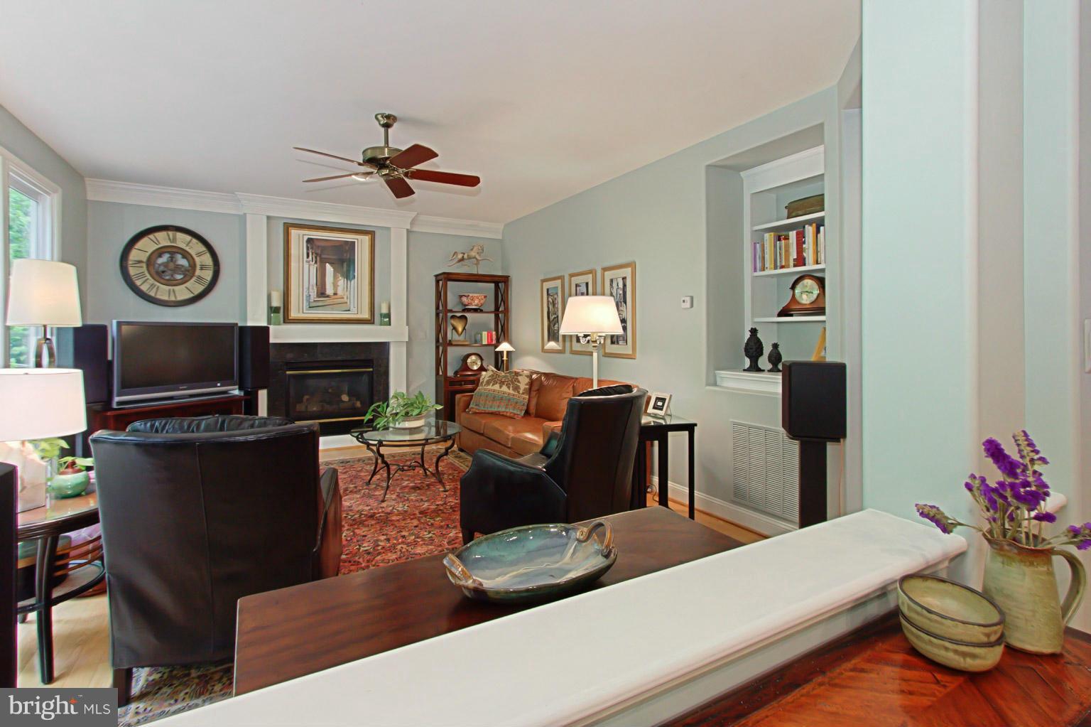 8548 Bauer Circle Springfield, VA 22152 - Photo 14 of 30 a living room with furniture and a fireplace