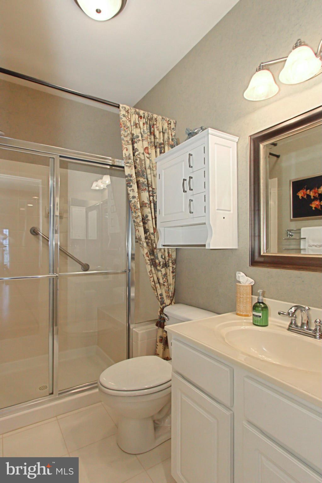8548 Bauer Circle Springfield, VA 22152 - Photo 18 of 30 a bathroom with a toilet sink and shower