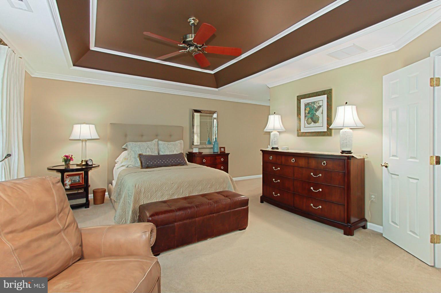 8548 Bauer Circle Springfield, VA 22152 - Photo 21 of 30 a bedroom with a bed and ceiling fan