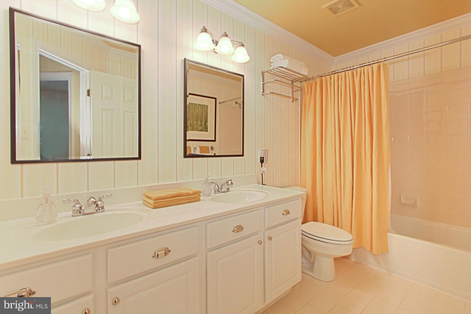 8548 Bauer Circle Springfield, VA 22152 - Photo 26 of 30 a bathroom with a sink a toilet and a mirror