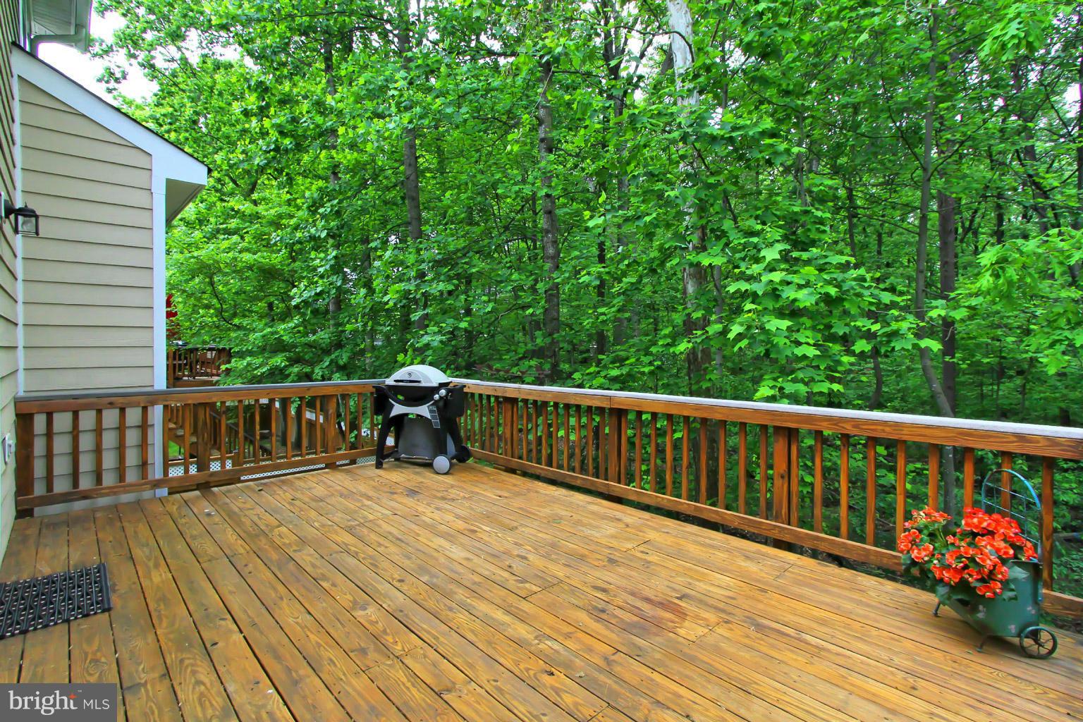 8548 Bauer Circle Springfield, VA 22152 - Photo 27 of 30 a view of balcony with wooden floor and fence