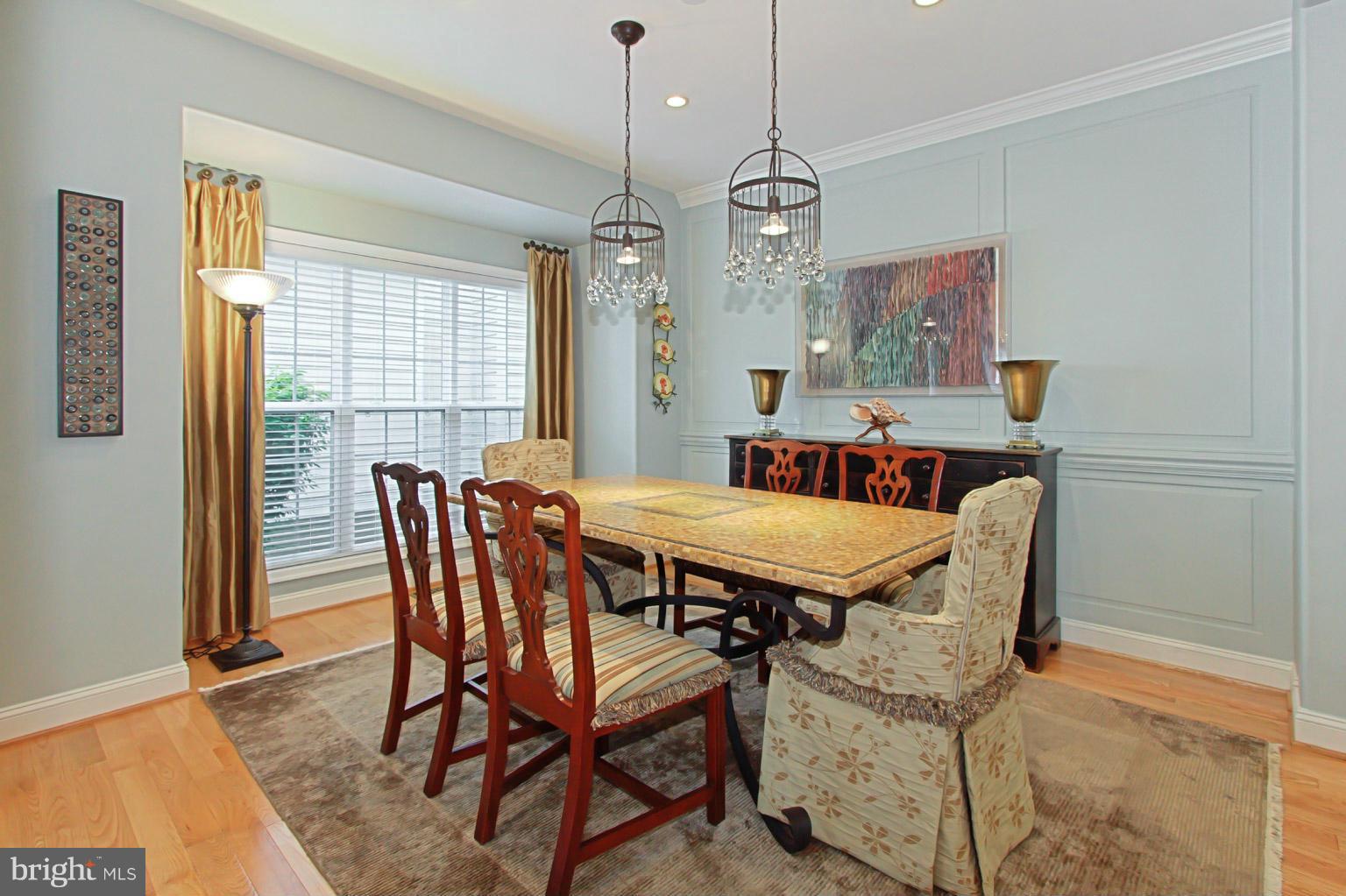 8548 Bauer Circle Springfield, VA 22152 - Photo 8 of 30 a view of a dining room with furniture window and wooden floor