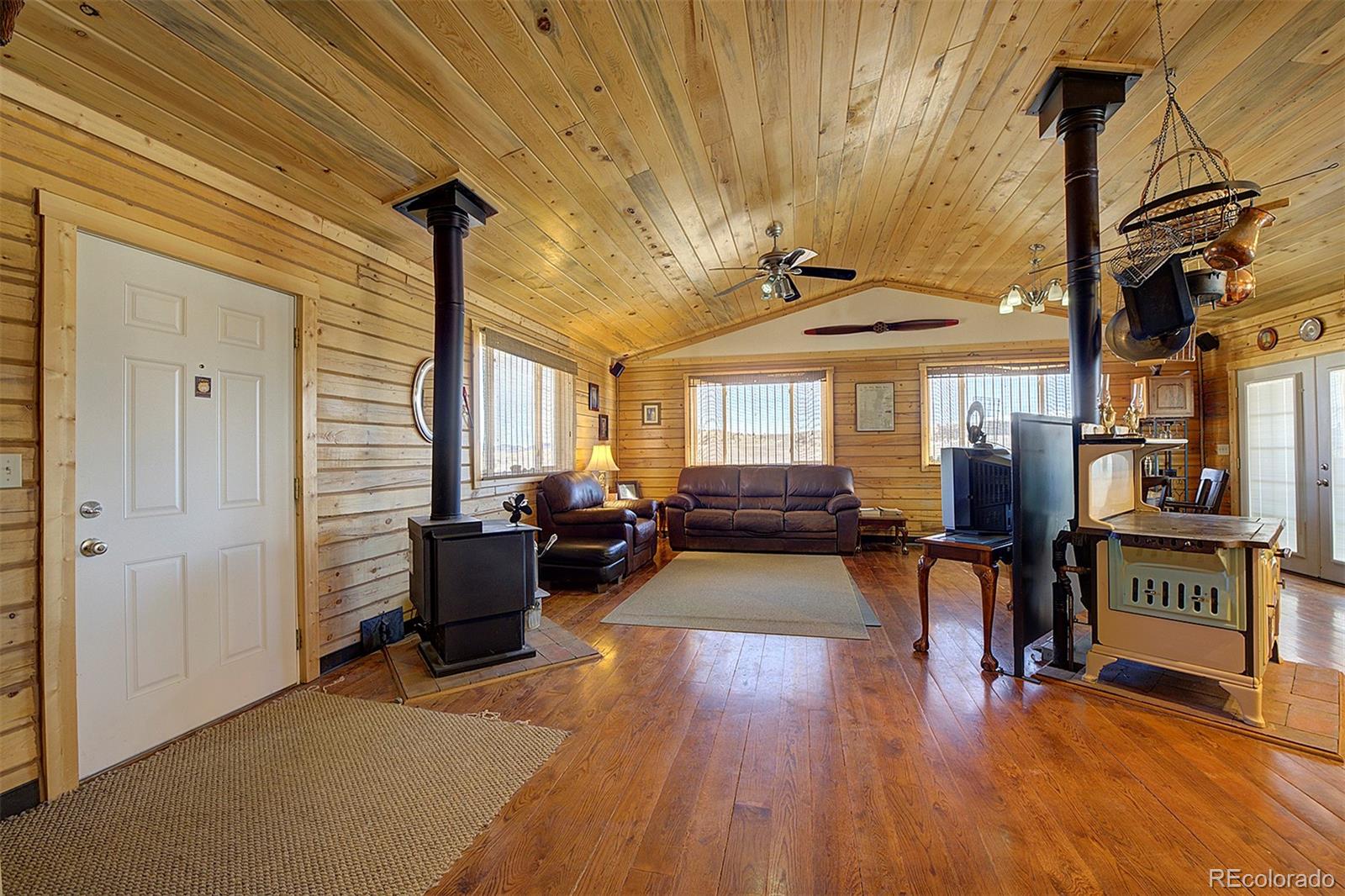 2005 Cahokia Road Hartsel, CO 80449 - Photo 19 of 42 a living room with furniture and a wooden floor