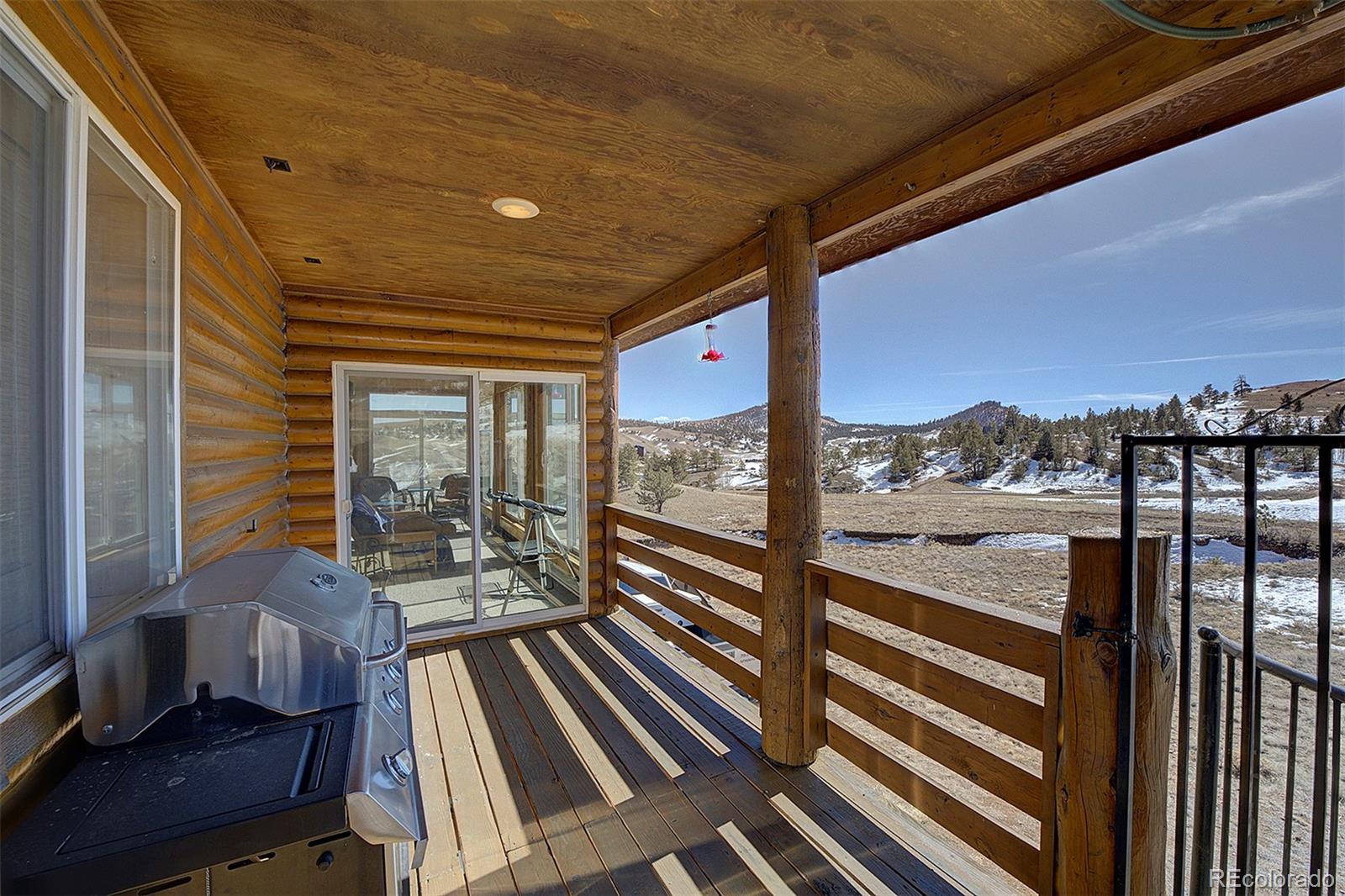 2005 Cahokia Road Hartsel, CO 80449 - Photo 33 of 42 a view of a balcony with furniture and wooden floor