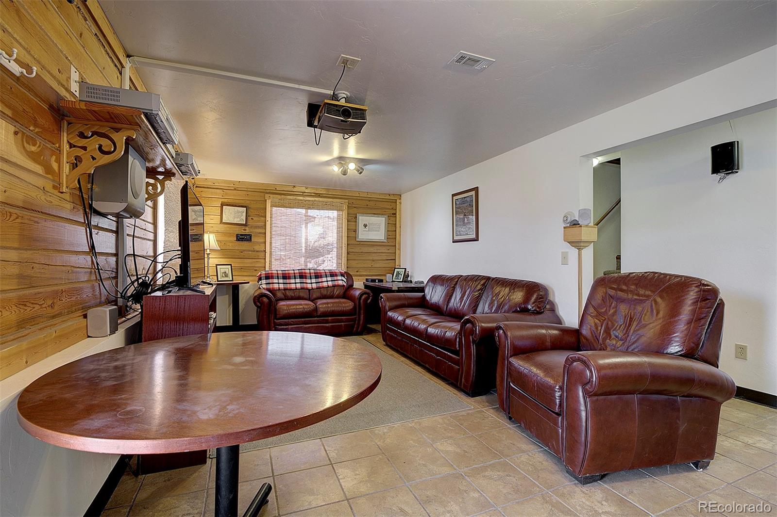 2005 Cahokia Road Hartsel, CO 80449 - Photo 4 of 42 a living room with furniture and a chandelier
