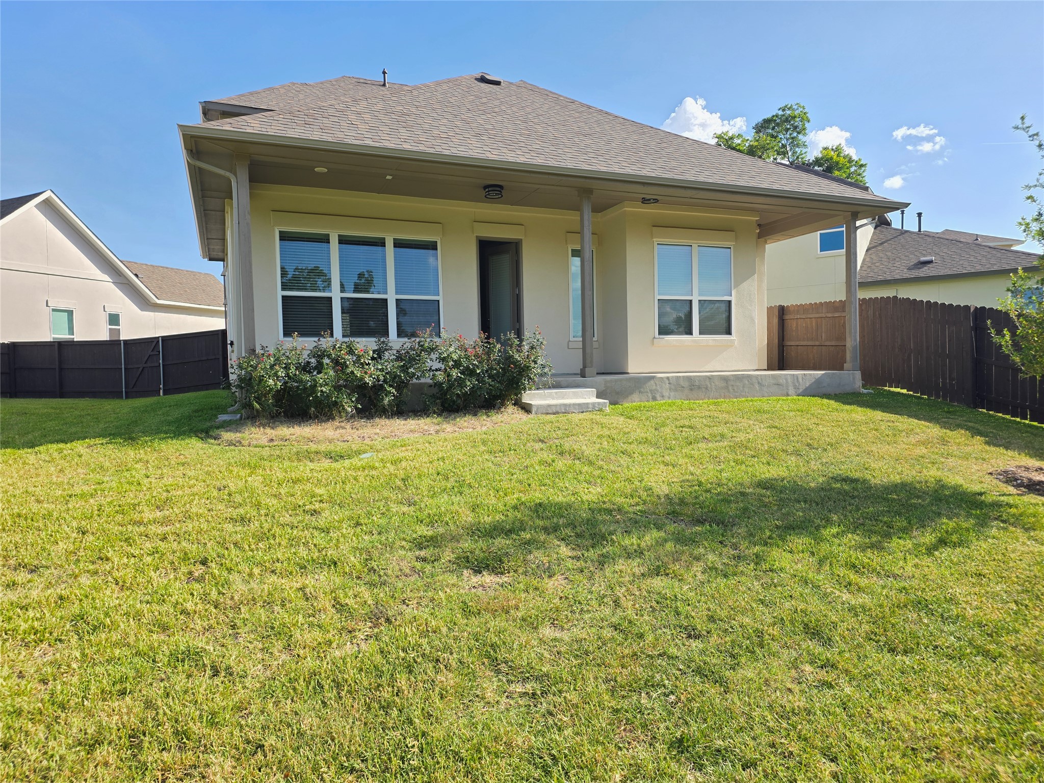 600 C-Bar Ranch Trail, Unit 121 Cedar Park, TX 78613 - Photo 31 of 32 A private yard with a covered patio offers ample space for outdoor enjoyment and relaxation.