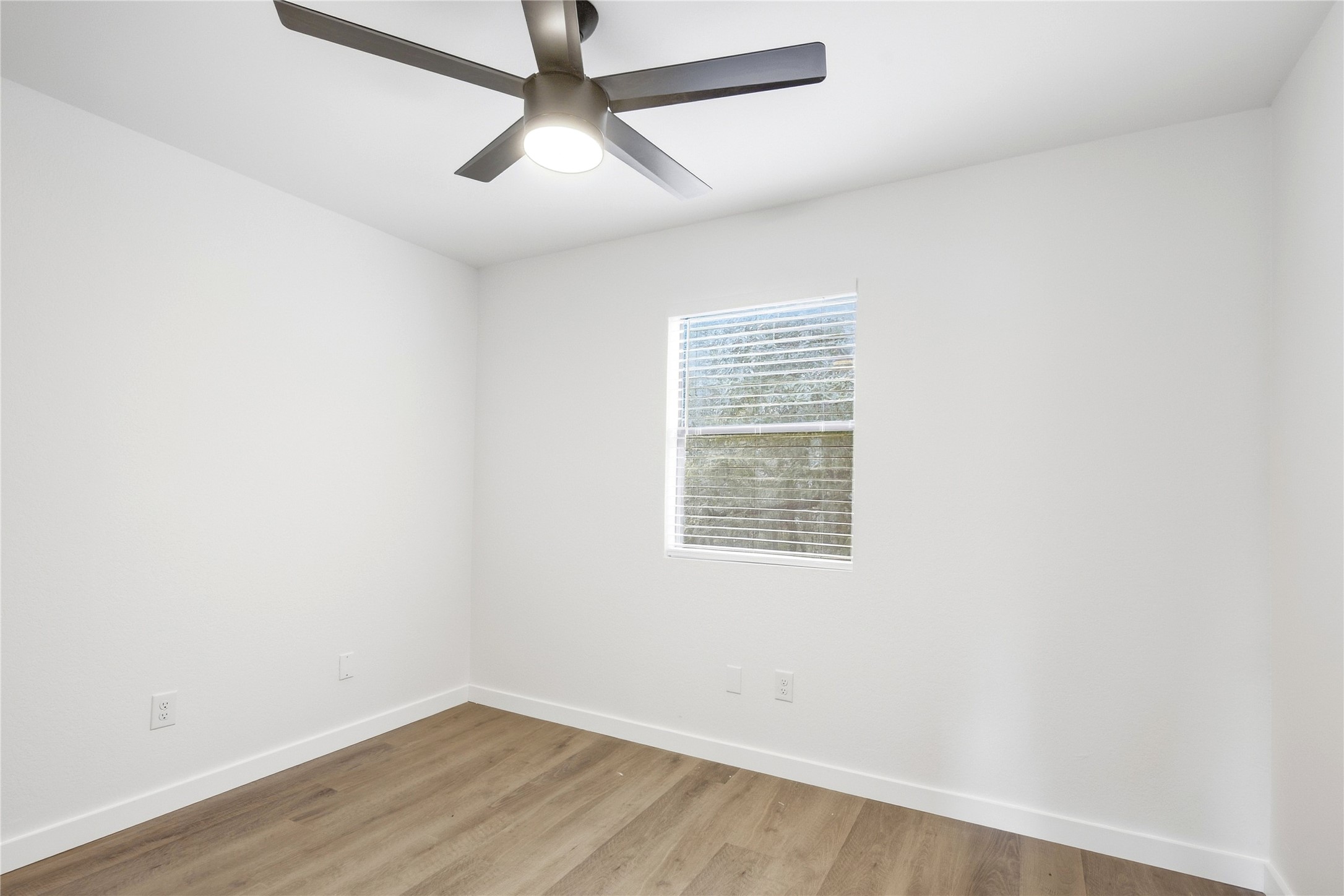 2500 Jones Road, Unit B Austin, TX 78745 - Photo 36 of 37 Clean lines and warm wood-style flooring define this versatile auxiliary space.