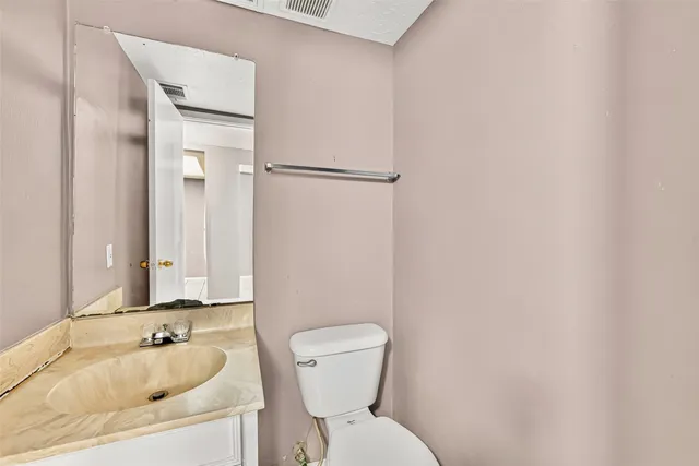 a bathroom with a sink and toilet