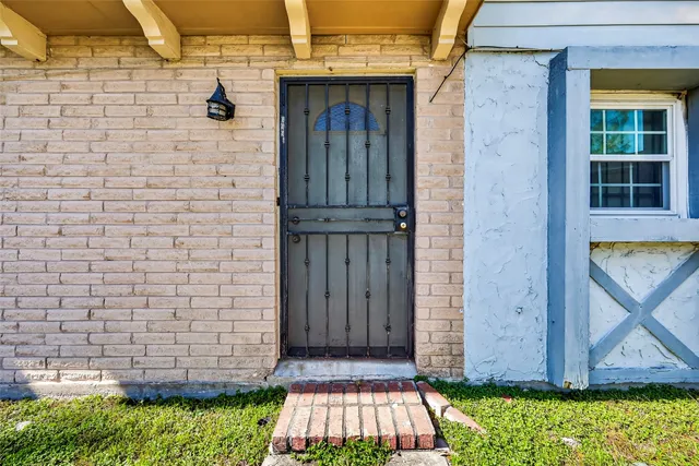 a view of front door of house with yard