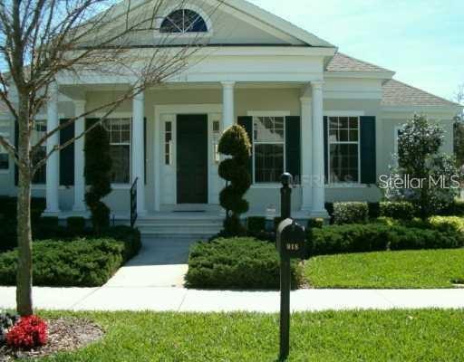 918 Spring Park Loop Celebration, FL 34747 - Photo 1 of 1 a front view of a house with garden