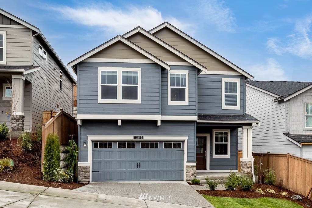 19 180th Place Southeast, Unit 43 Bothell, WA 98012 - Photo 1 of 26 a front view of a house with a yard