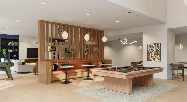 a living room with fireplace furniture and a large window