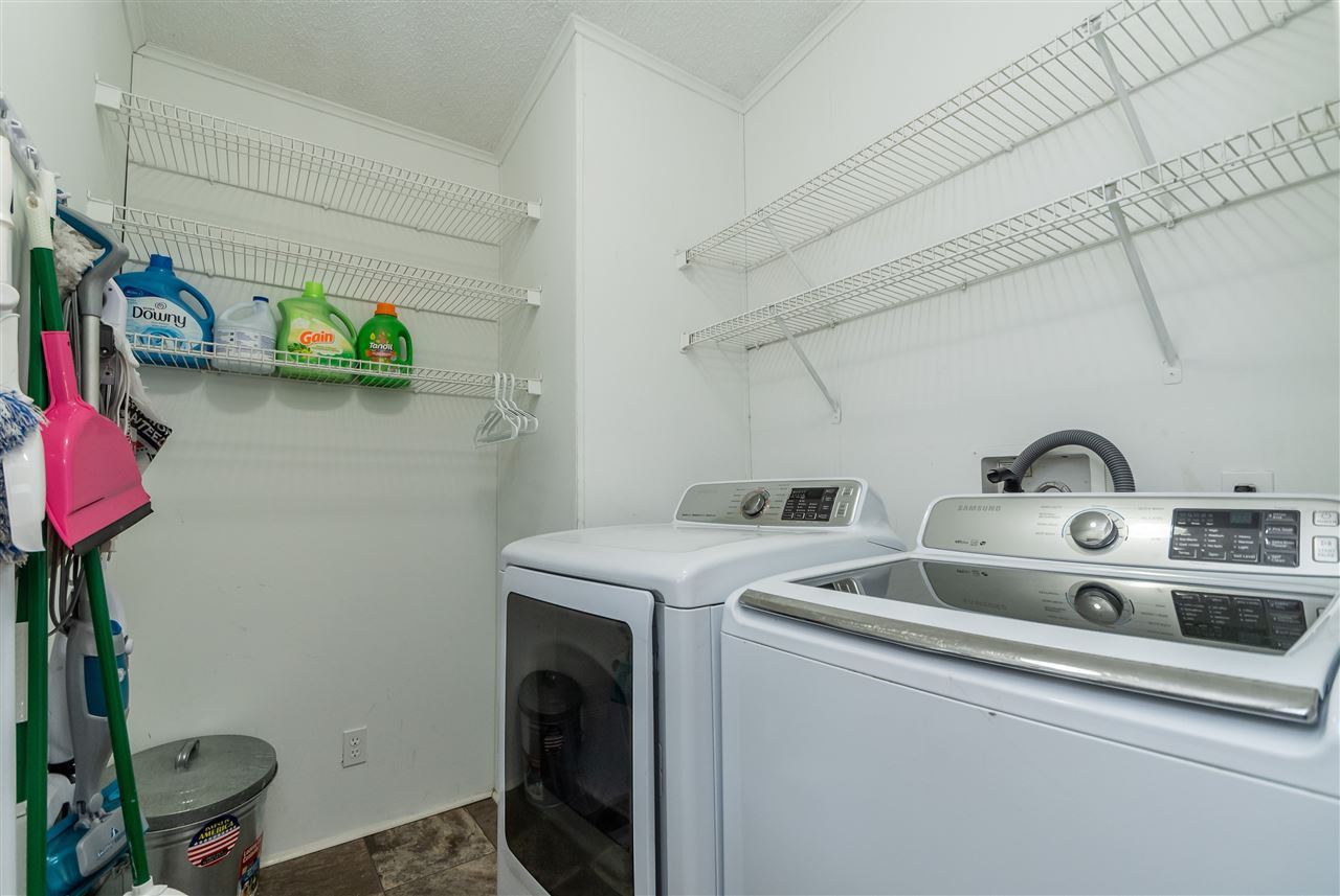 8409 Creek Road Willow Spring, NC 27592 - Photo 17 of 27 a utility room with dryer and washer